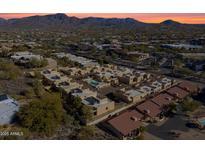 Aerial view of a community with a pool and desert landscape at 37222 N Tom Darlington Dr # 2, Carefree, AZ 85377