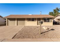 Ranch style home with two car garage and rock landscaping at 7118 E Arbor Ave, Mesa, AZ 85208