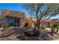 Single-story home with stucco exterior, landscaped yard, and two-car garage at 9023 N Crown Ridge --, Fountain Hills, AZ 85268