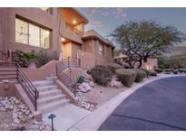 Front view of a contemporary home with landscaping and walkway at 10222 E Southwind E Ln # 1026, Scottsdale, AZ 85262