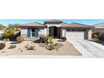 One-story home with desert landscaping, two-car garage, and neutral exterior at 15207 S 183Rd Ave, Goodyear, AZ 85338