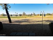 Peaceful backyard view overlooking a golf course at 19462 N Star Ridge Dr, Sun City West, AZ 85375