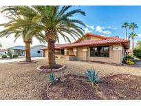 Single-story home with desert landscaping and a red tile roof at 19606 N Trail Ridge Dr, Sun City West, AZ 85375