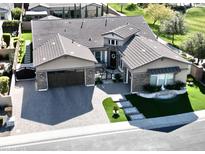 Stunning curb appeal with a 3-car garage and manicured landscaping at 2351 E Cherrywood Pl, Chandler, AZ 85249