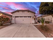 Single-story home with two-car garage and landscaped front yard at 26222 W Behrend Dr, Buckeye, AZ 85396