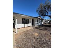 Ranch style home with covered porch and spacious front yard at 3028 W Bloomfield Rd, Phoenix, AZ 85029