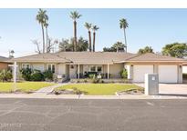 Beautiful ranch-style home with landscaped yard and two-car garage at 4591 E Calle Ventura --, Phoenix, AZ 85018