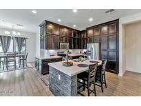 Modern kitchen with stainless steel appliances and an island at 6565 E Thomas Rd # 1015, Scottsdale, AZ 85251