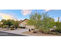 Desert landscaping surrounds this single-story home with a two-car garage at 9600 E Balancing Rock Rd, Scottsdale, AZ 85262