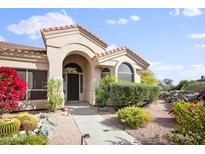 Spanish style home with landscaped front yard, walkway, and desert landscaping at 15020 E Sierra Madre Dr, Fountain Hills, AZ 85268