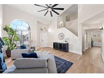 Bright living room featuring hardwood floors, a ceiling fan, and comfortable seating at 1744 W Encinas St, Gilbert, AZ 85233