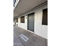 Exterior view of a building showing a walkway and multiple apartment entrances at 18202 N Cave Creek Rd # 108, Phoenix, AZ 85032