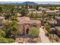 Two-story house with a landscaped yard, driveway, and mountain views at 3731 E Fruitvale Ave, Gilbert, AZ 85297