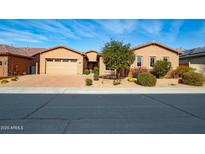 Single-story home with a two-car garage and desert landscaping at 5626 E Sleepy Ranch Rd, Cave Creek, AZ 85331