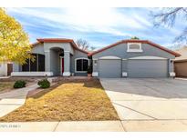 Single-story house with three-car garage and landscaped front yard at 917 E Betsy Ln, Gilbert, AZ 85296