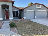 Two-story house with double garage and well-maintained front yard at 917 E Betsy Ln, Gilbert, AZ 85296