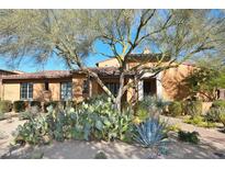 Single-story home with desert landscaping and Spanish-style architecture at 20704 N 90Th Pl # 1008, Scottsdale, AZ 85255