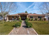 Beautiful ranch home with landscaped yard and inviting walkway at 3213 N 41St Pl, Phoenix, AZ 85018