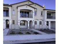 Two-story townhome with balcony and neutral color scheme at 4130 E Pinto Dr, Gilbert, AZ 85296