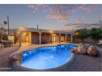 Expansive backyard oasis featuring a sparkling pool and spacious patio at 5028 N Scottsdale Rd, Paradise Valley, AZ 85253