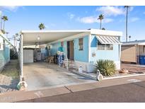 Inviting mobile home with carport and landscaped yard at 7807 E Main St # B-15, Mesa, AZ 85207