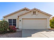 Single-story house with a two-car garage and landscaping at 901 N Longmore St, Chandler, AZ 85224