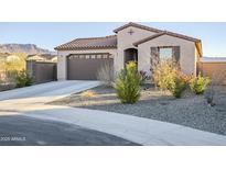 Single-story home with desert landscaping and two-car garage at 12474 E Soloman Rd, Gold Canyon, AZ 85118