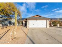 Charming single-story home featuring a two-car garage, xeriscaped yard, and solar panels at 21063 N 33Rd Ln, Phoenix, AZ 85027