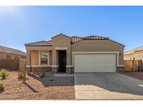 Single-story home with a two-car garage and desert landscaping at 2455 E Alida Trl, Casa Grande, AZ 85194