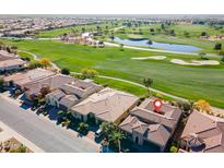 Aerial view of a house on a golf course community at 1401 E Sweet Citrus Dr, Queen Creek, AZ 85140