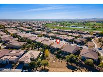 Expansive aerial view of a residential community with desert landscaping, near a lush golf course and mountain views at 1416 E Artemis Trl, Queen Creek, AZ 85140