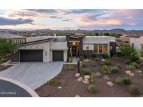 Stunning modern home with desert landscaping, two-car garage, and mountain views at 17220 E Lonesome Canyon Ct, Rio Verde, AZ 85263