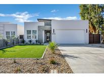 Modern home with a two-car garage and landscaped front yard at 2336 N 28Th Pl, Phoenix, AZ 85008