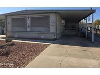 Mobile home with covered porch and ramp access at 2650 W Union Hills Dr # 33, Phoenix, AZ 85027