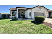 Single-story home with a well-manicured lawn and two-car garage at 3649 E Cody Ave, Gilbert, AZ 85234