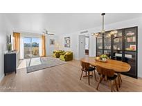 Bright and spacious living room with wood floors, and mid-century furniture at 4600 N 68Th St # 370, Scottsdale, AZ 85251