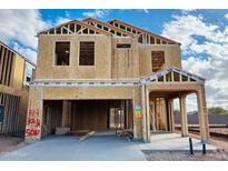 Unfinished two-story home with visible framing and a two-car garage, offering potential for customization at 5087 E Umber Rd, San Tan Valley, AZ 85143