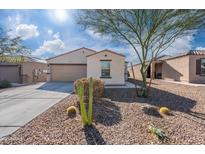 One-story house with desert landscaping and two-car garage at 12657 W Myrtle Ave, Glendale, AZ 85307