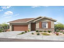 Single-story home with brown garage doors and brick accents at 14832 W Cottontail Ln, Surprise, AZ 85387