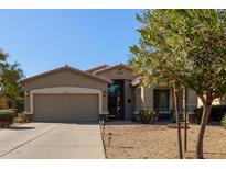 One-story house with a two-car garage and desert landscaping at 5126 S Sugarberry Ct, Gilbert, AZ 85298