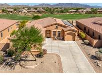 Aerial view of a beautiful one-story home with a large backyard and golf course views at 12963 S 183Rd Ave, Goodyear, AZ 85338
