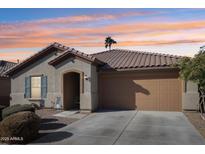 Beautiful one-story home with a two-car garage and landscaped front yard at 1436 N Claiborne --, Mesa, AZ 85205