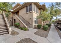 Attractive condo complex with beautiful desert landscaping and staircase access to the upper units at 20100 N 78Th Pl # 1062, Scottsdale, AZ 85255