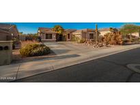 Single-story home with landscaped front yard and driveway at 4112 S Prairie Zinnia Dr, Gold Canyon, AZ 85118