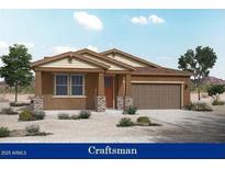 Craftsman style home with brown stucco and a two-car garage at 12722 W Luxton Ln, Avondale, AZ 85323