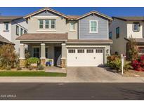 Two-story home with white garage door and landscaping at 1336 E Sierra Vista Dr, Phoenix, AZ 85014