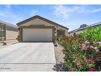 Single-story house with attached garage and well-maintained landscaping at 24013 N Mojave Ln, Florence, AZ 85132