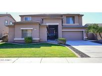 Two-story house with a landscaped lawn and attached garage at 3267 E Maplewood St, Gilbert, AZ 85297