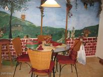 Cozy dining area with a charming wall mural, perfect for Gathering meals at 440 S Val Vista Dr # 52, Mesa, AZ 85204