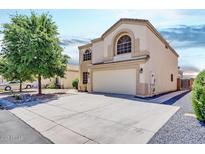 Two-story house with a large garage and well-maintained landscaping at 5725 E Good Pasture Ln, Florence, AZ 85132